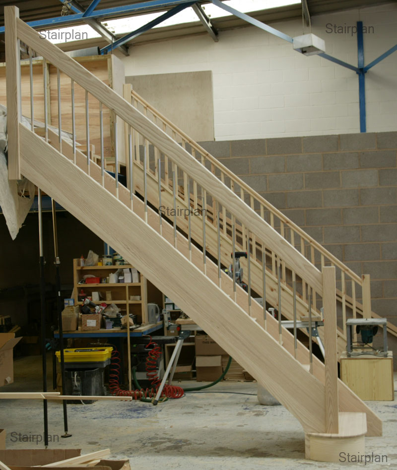 Handrail installer measuring a staircase in London property